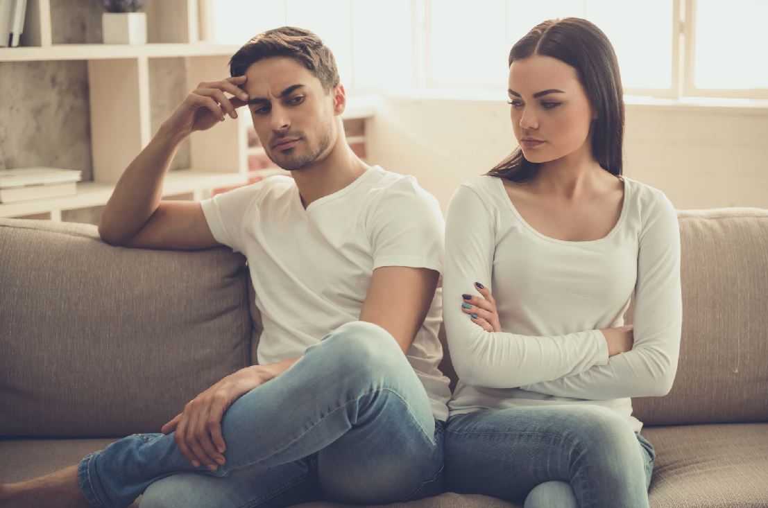 Couple sitting apart during a difficult moment